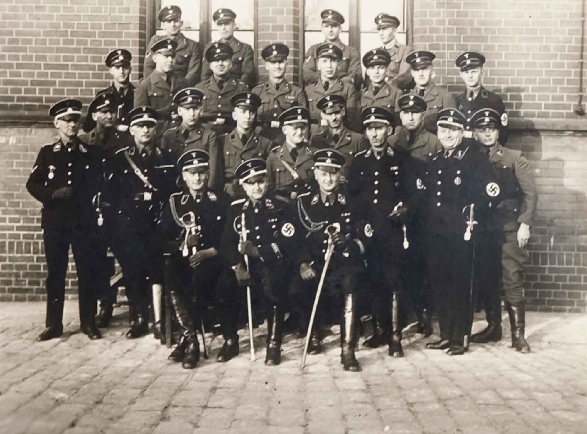 Klein with senior camp officials (seated in the center)