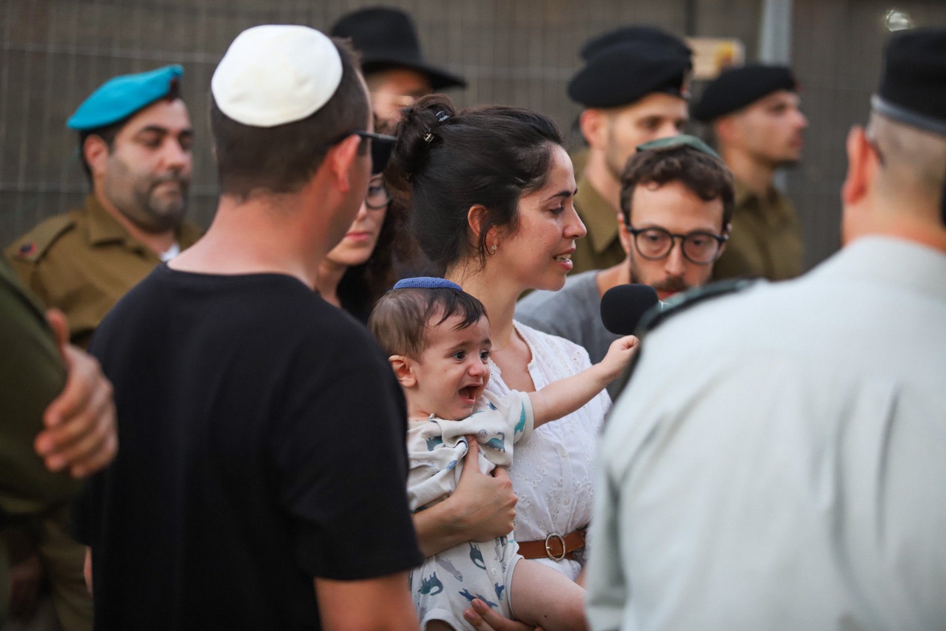 Baby Lior at his father's funeral