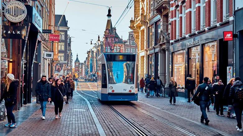 Protesters in Amsterdam torch tram as fresh riots erupt