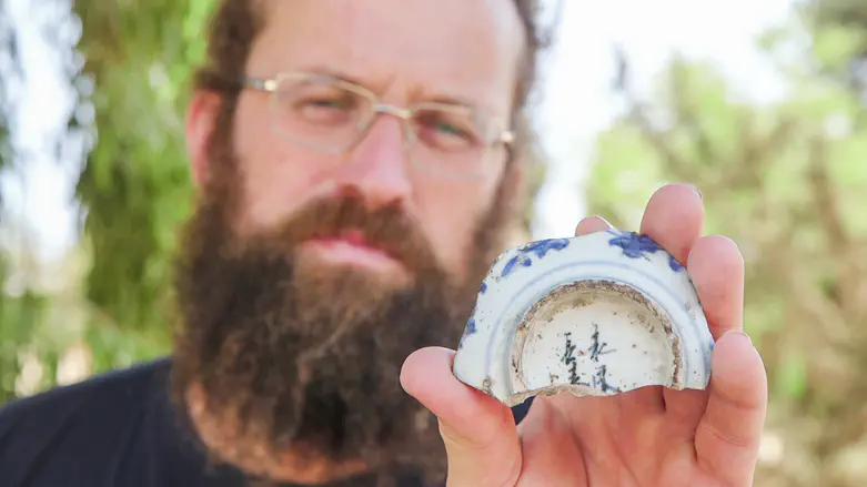 Michael Chernin from the Israel Antiquities Authority with the inscription he found. Emil Aladjem, Israel Antiquities Authority